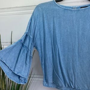Style Envy size medium light weight denim loose top.